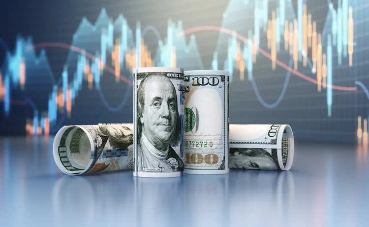 US banknotes in front of a graph